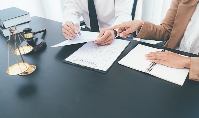 Legal documents representing compliance requirements for a tutoring business